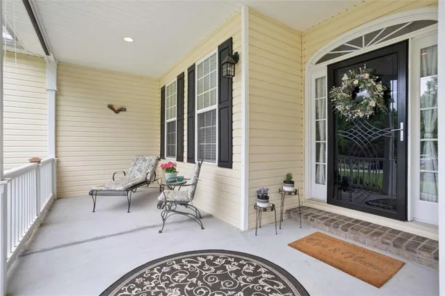 a living room with furniture and a rug