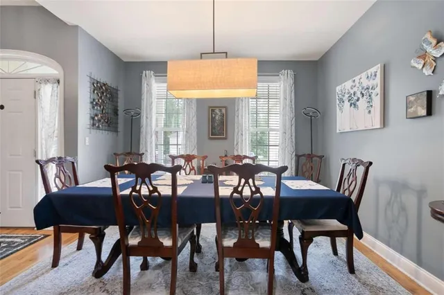 a view of a dining room with furniture and window