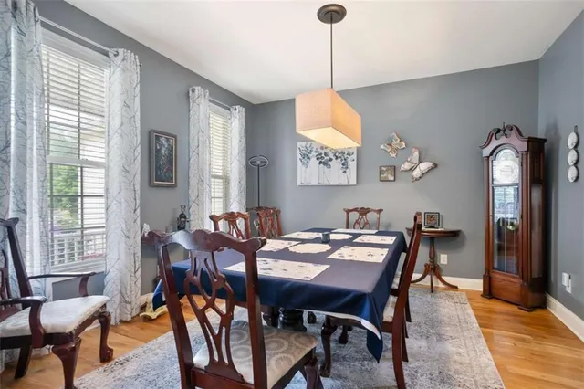 a view of a dining room with furniture window and outside view