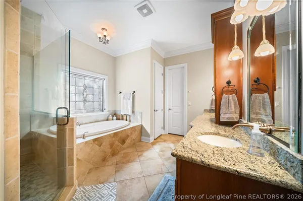 a bathroom with bathtub and shower