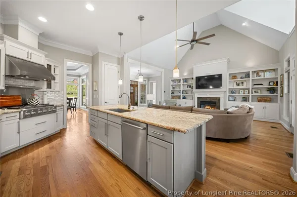a stove top oven sitting inside of a kitchen