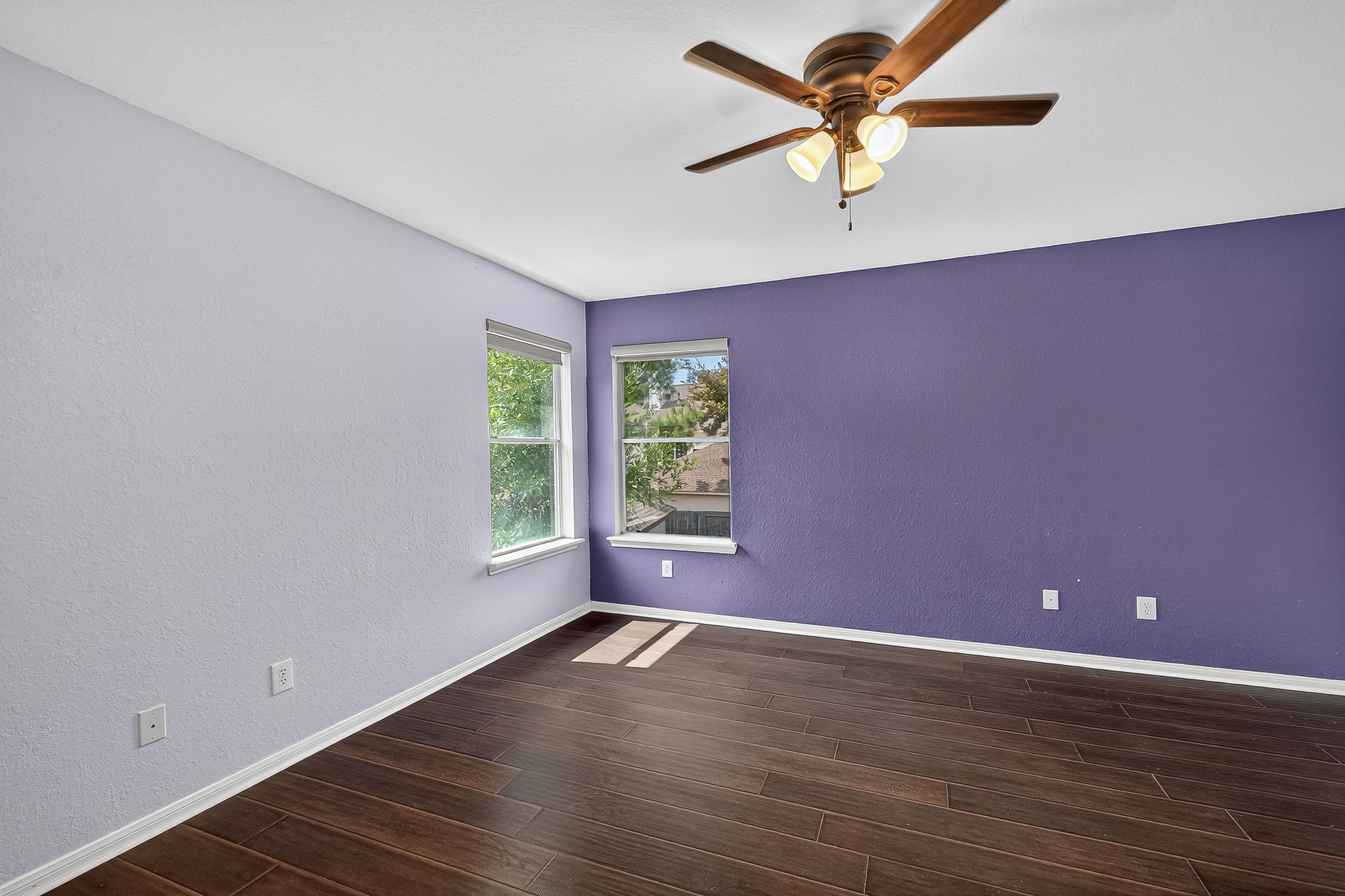 22406 Piper Terrace Lane Katy, TX 77450 - Photo 36 of 44 a view of room with window ceiling fan and wooden floor
