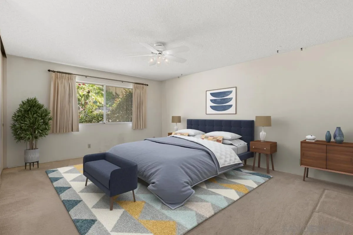 1740 Kirk Place Carlsbad, CA 92008 - Photo 11 of 22 a bedroom with a large bed and a couch