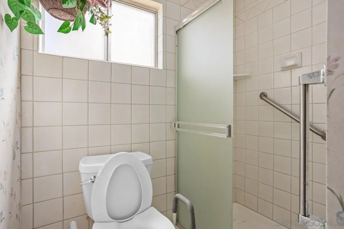 1740 Kirk Place Carlsbad, CA 92008 - Photo 14 of 22 a bathroom with a toilet and a shower