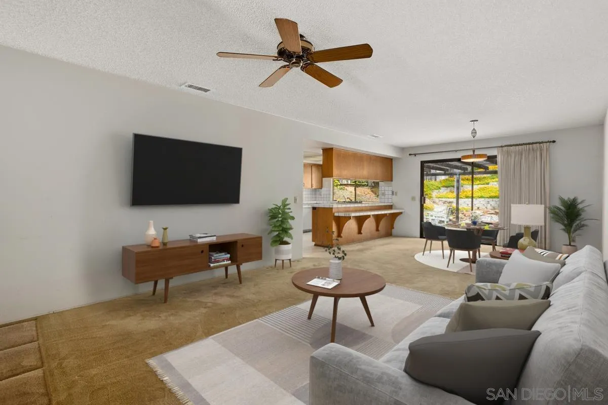 1740 Kirk Place Carlsbad, CA 92008 - Photo 3 of 22 a living room with furniture a rug and a flat screen tv