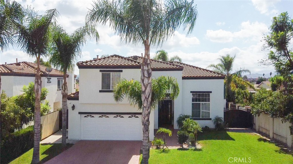 11134 Baker Lane Riverside, CA 92505 - Photo 1 of 1 a front view of house with yard and green space