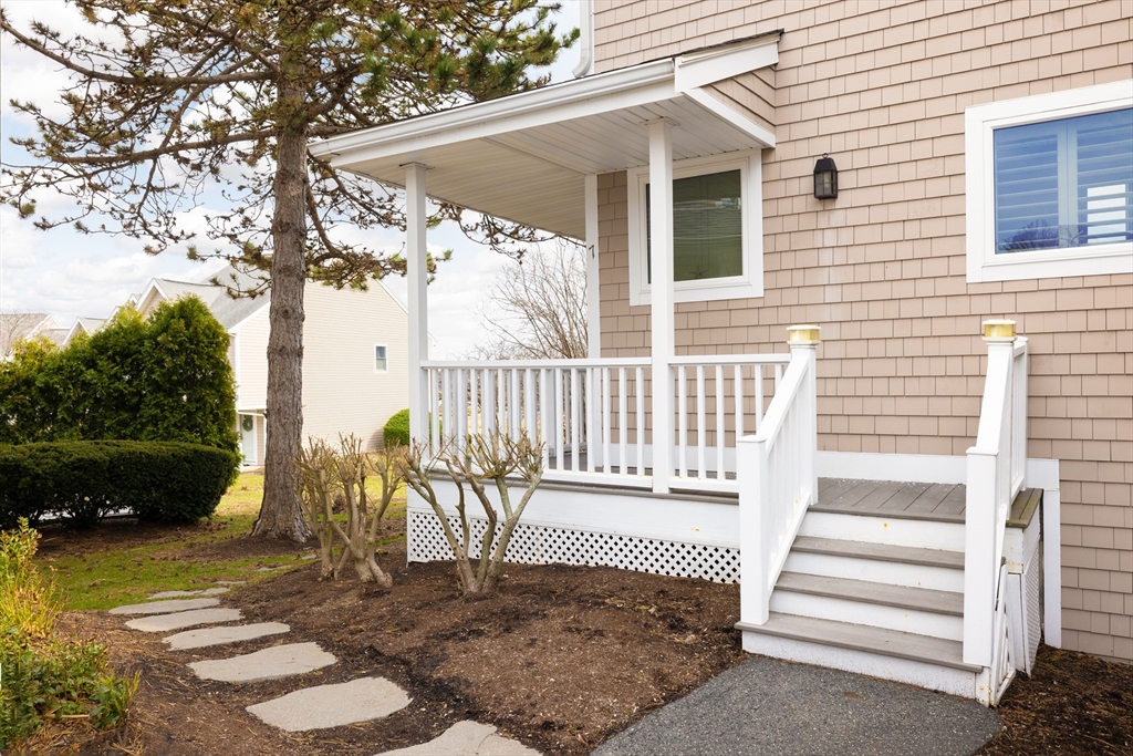 7 Cutter Lane, Unit 7 Quincy, MA 02171 - Photo 14 of 28 a view of a chair and table in backyard of the house