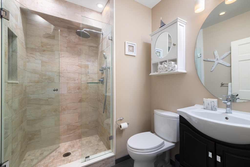 7 Cutter Lane, Unit 7 Quincy, MA 02171 - Photo 10 of 28 a bathroom with a shower and a toilet