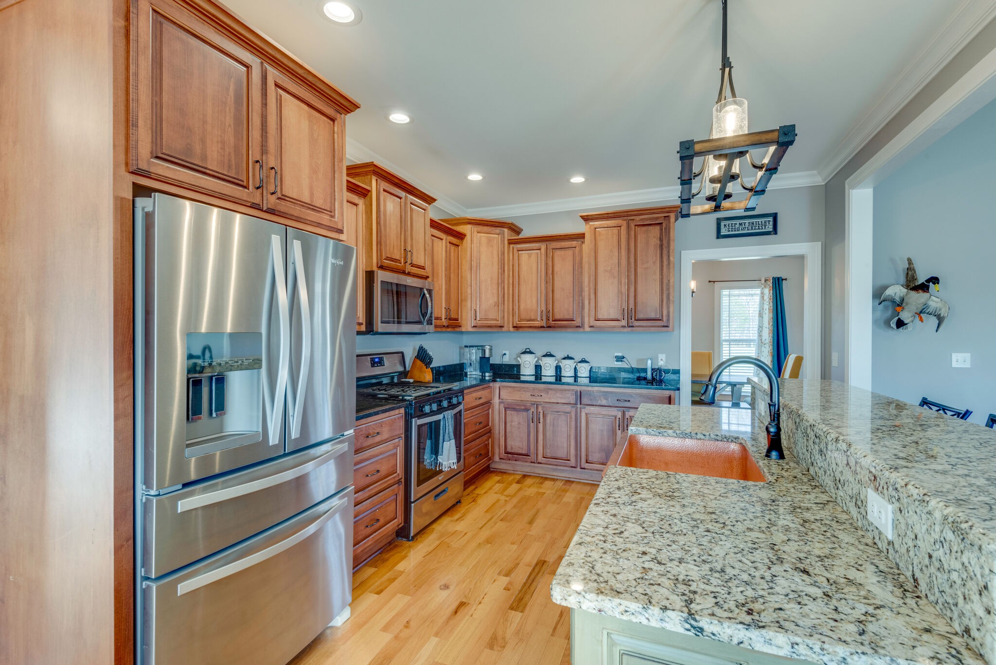 2822 Lock Hollow Road Dickson, TN 37055 - Photo 16 of 45 a kitchen with stainless steel appliances granite countertop a refrigerator a stove and a wooden floors