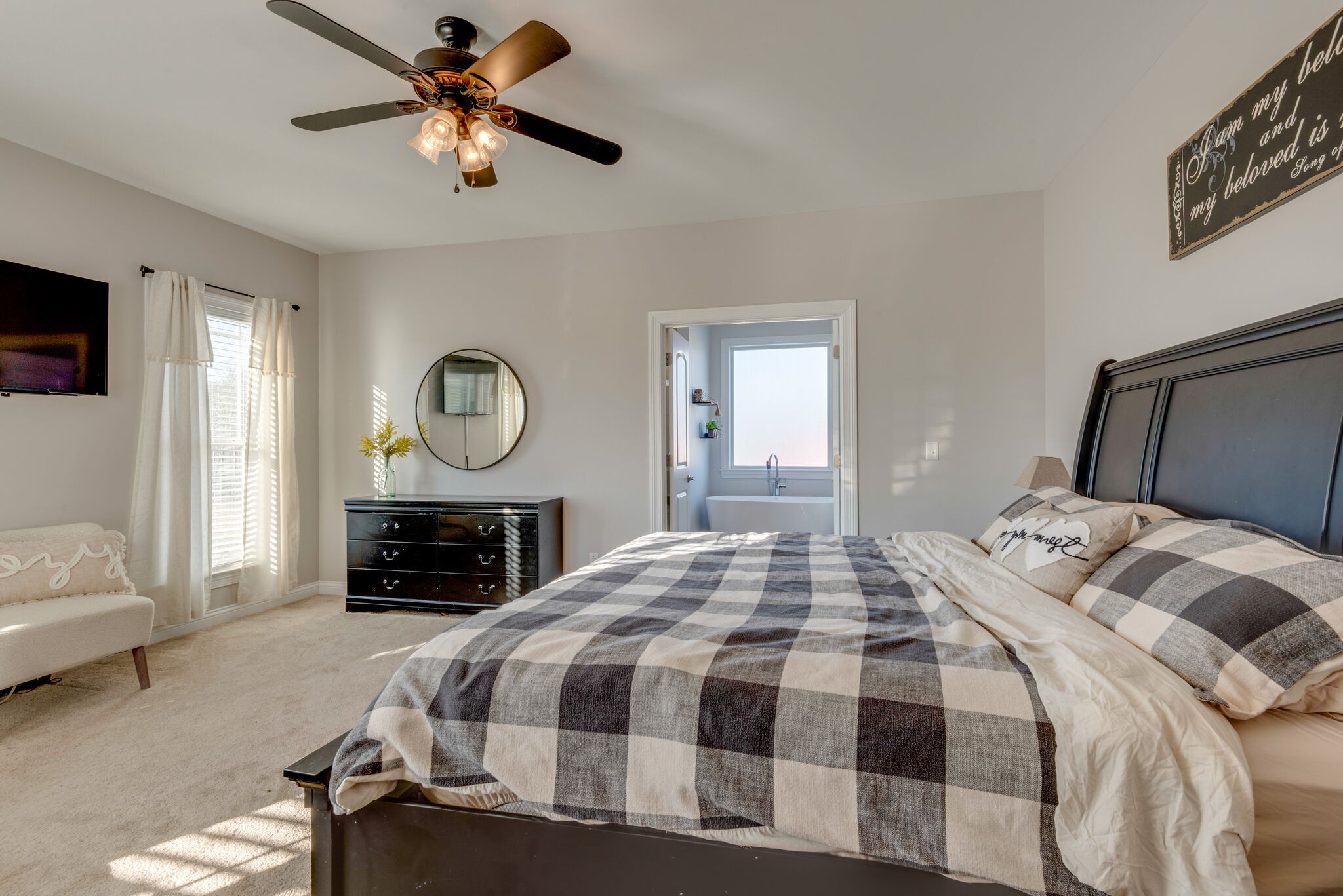 2822 Lock Hollow Road Dickson, TN 37055 - Photo 21 of 45 a bedroom with a bed a mirror and a window