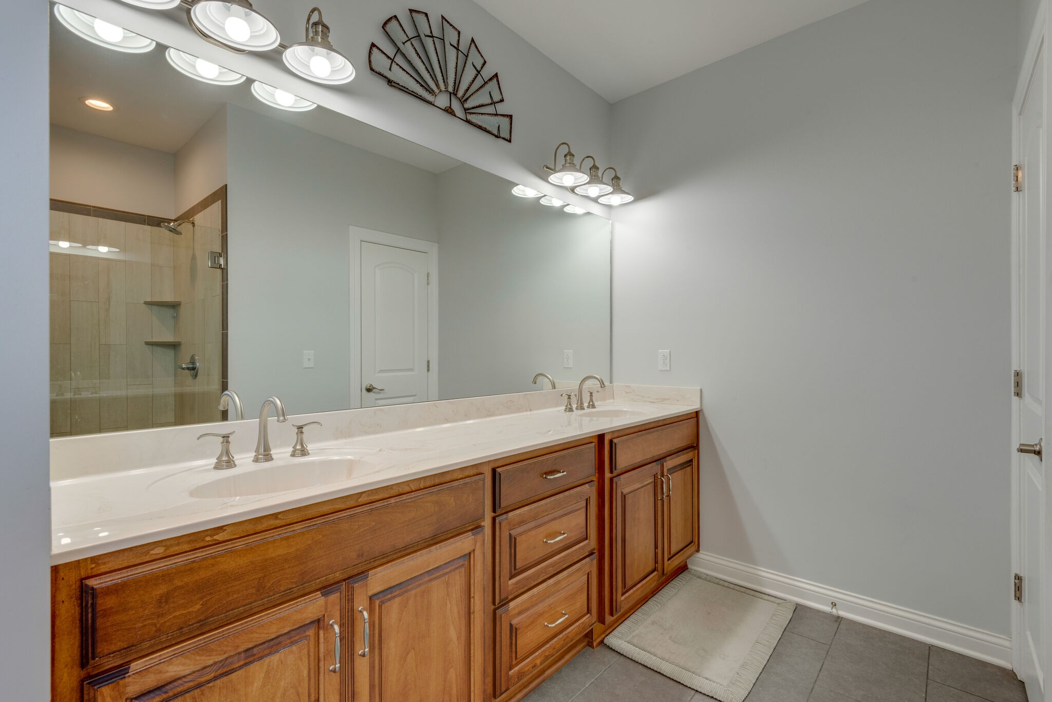 2822 Lock Hollow Road Dickson, TN 37055 - Photo 24 of 45 a bathroom with a double vanity sink and a mirror