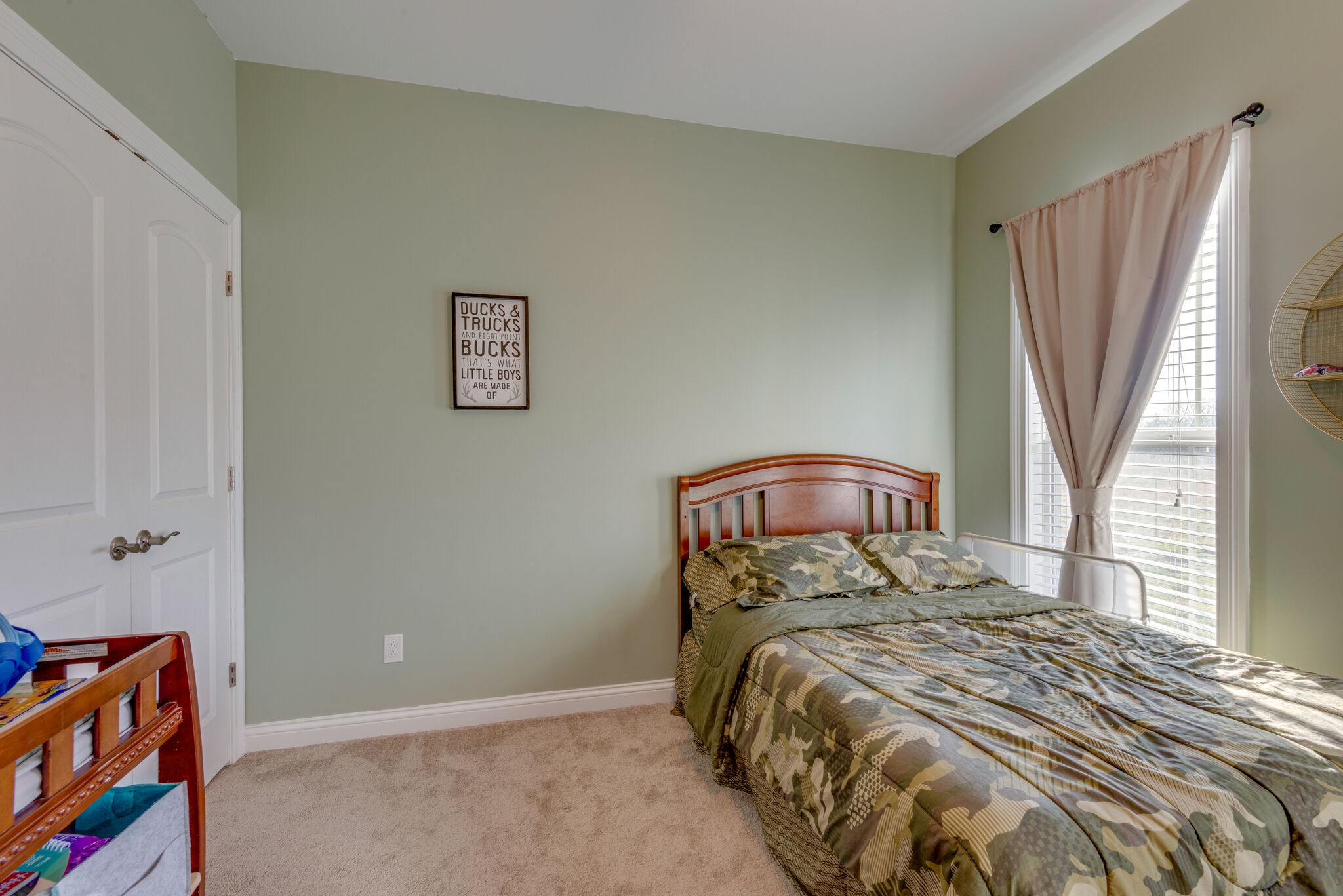 2822 Lock Hollow Road Dickson, TN 37055 - Photo 28 of 45 a bed sitting in a bedroom next to a window
