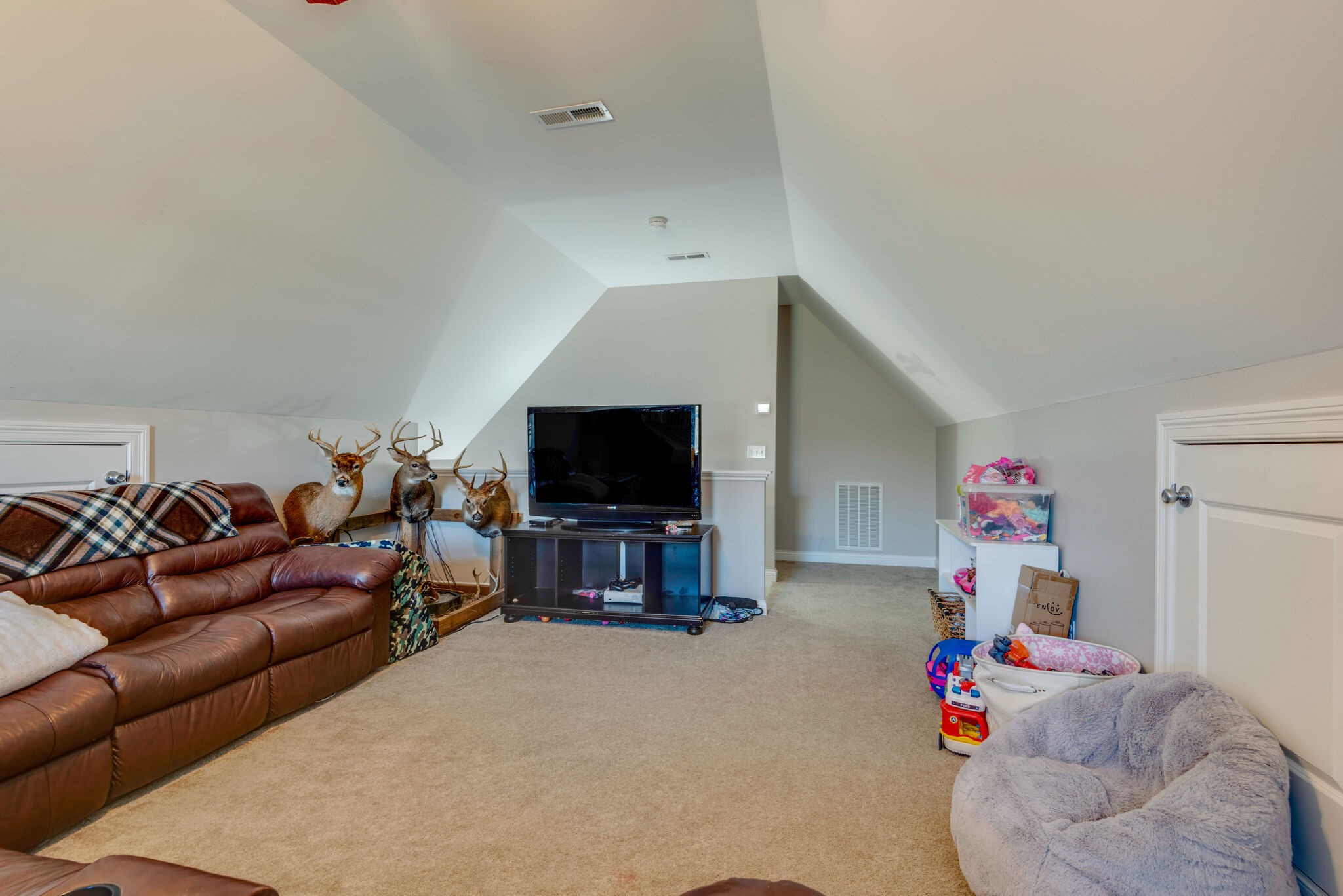 2822 Lock Hollow Road Dickson, TN 37055 - Photo 32 of 45 a living room with furniture and a flat screen tv