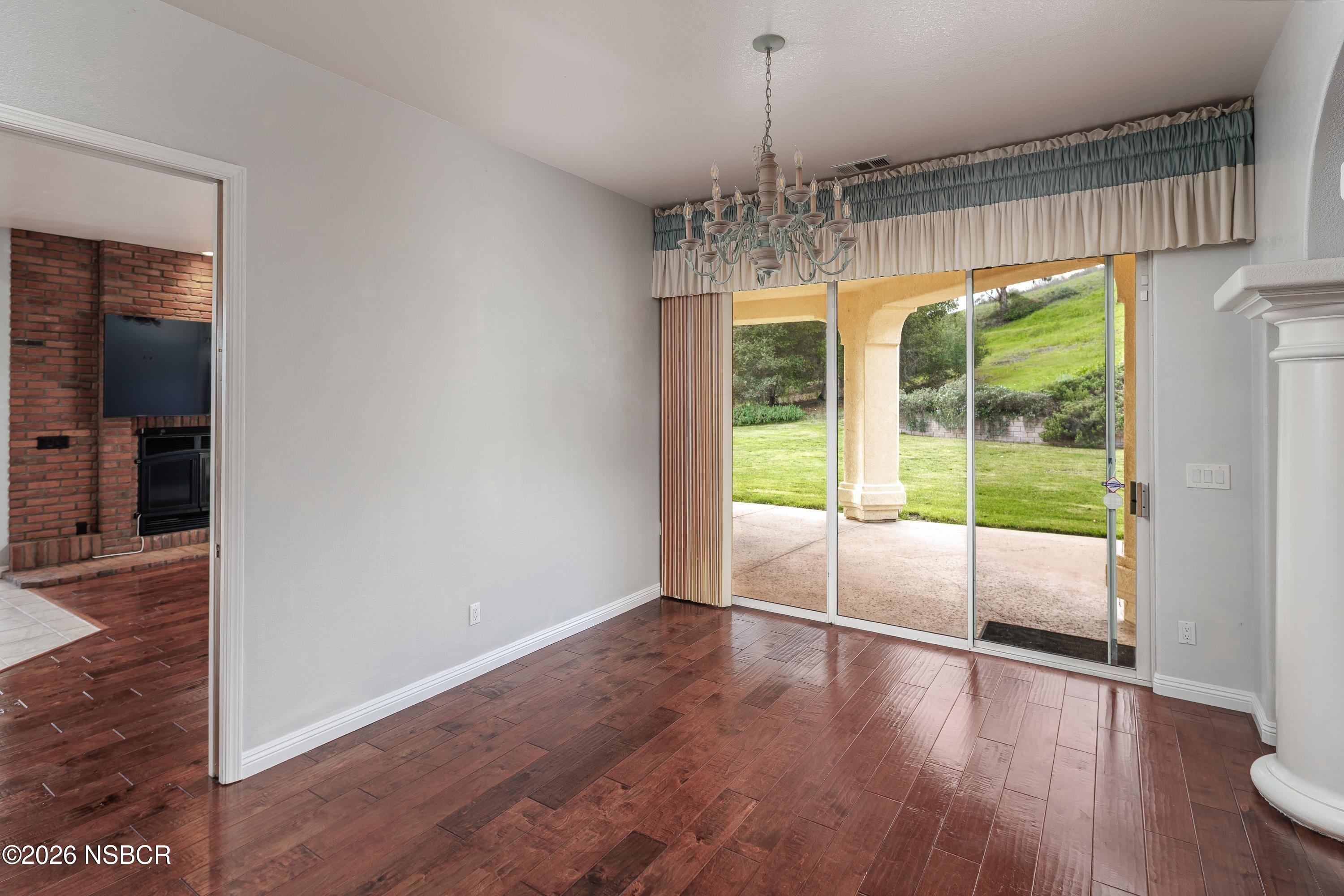 2655 Adobe Falls Road Lompoc, CA 93436 - Photo 15 of 51 a view of empty room with wooden floor and fan