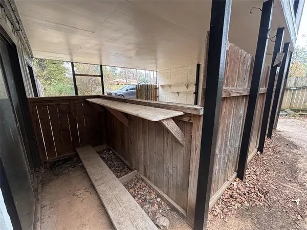 a kitchen with kitchen island wooden cabinets a sink and a refrigerator