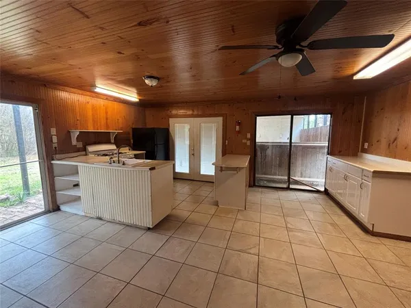a kitchen with stainless steel appliances granite countertop a stove a sink a refrigerator and cabinets
