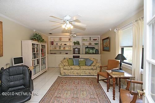 1295 Marlee Road St. Johns, FL 32259 - Photo 3 of 16 a living room with furniture and a chandelier