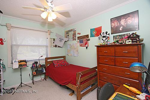 1295 Marlee Road St. Johns, FL 32259 - Photo 10 of 16 a bedroom with a bed and wooden floor