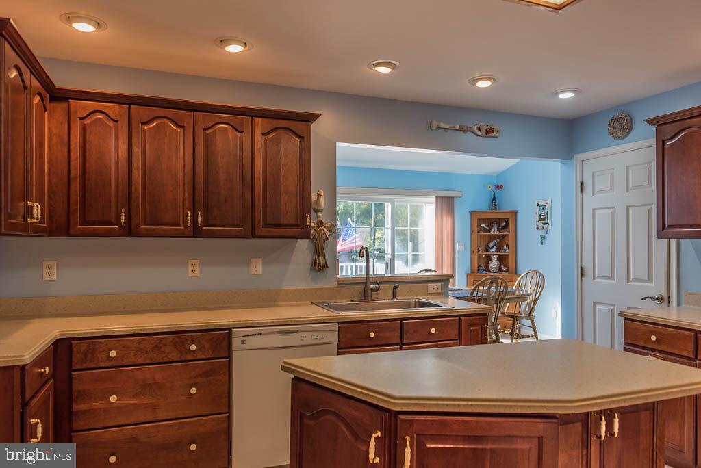 18 Brookside Road Berlin, MD 21811 - Photo 11 of 48 a kitchen with granite countertop a sink stainless steel appliances and cabinets