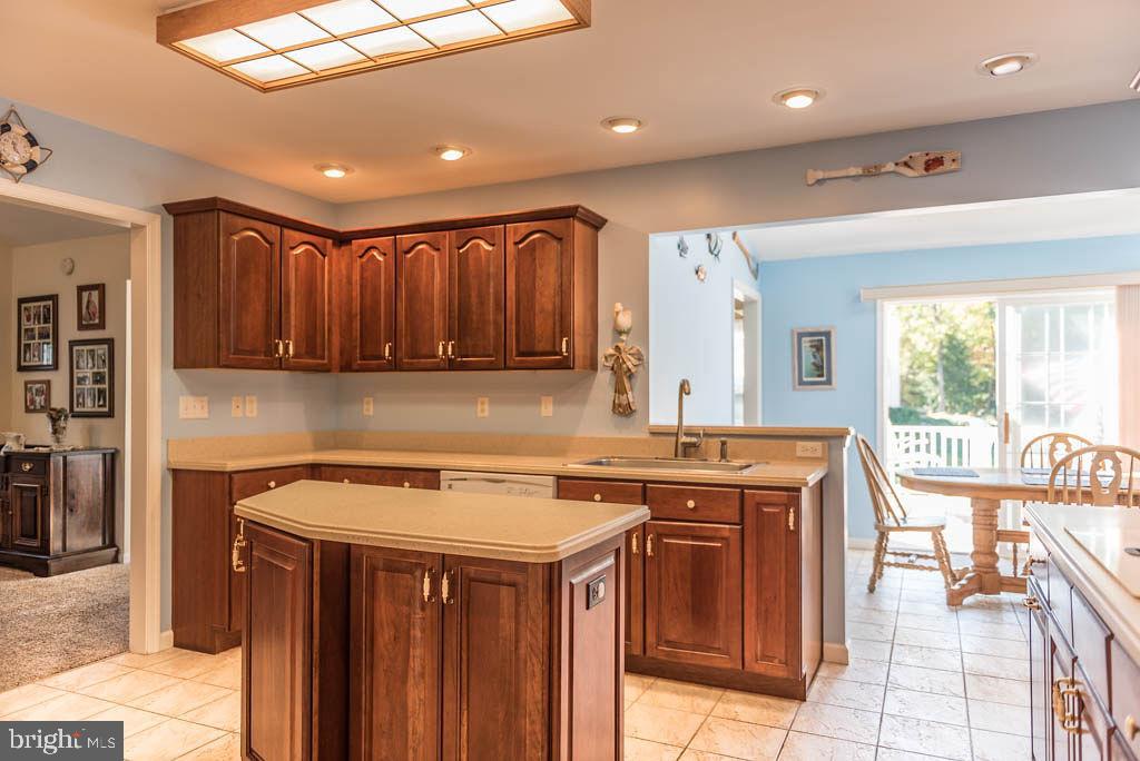 18 Brookside Road Berlin, MD 21811 - Photo 14 of 48 a kitchen with a sink stove and cabinets