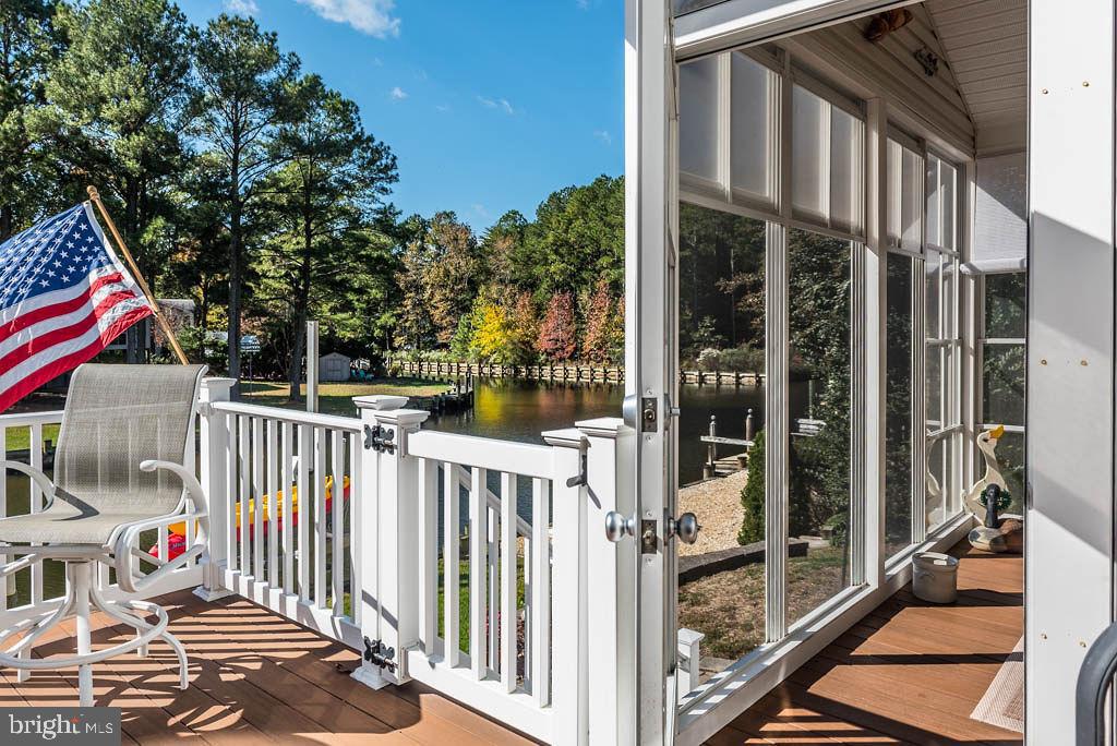 18 Brookside Road Berlin, MD 21811 - Photo 31 of 48 a view of a balcony with door and wooden floor