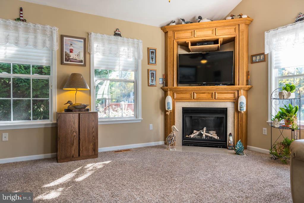 18 Brookside Road Berlin, MD 21811 - Photo 8 of 48 a living room with furniture and a flat screen tv