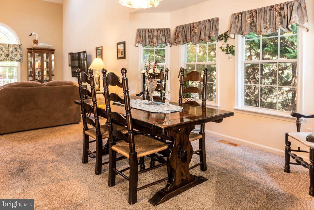 18 Brookside Road Berlin, MD 21811 - Photo 10 of 48 a view of a dining room with furniture and chandelier