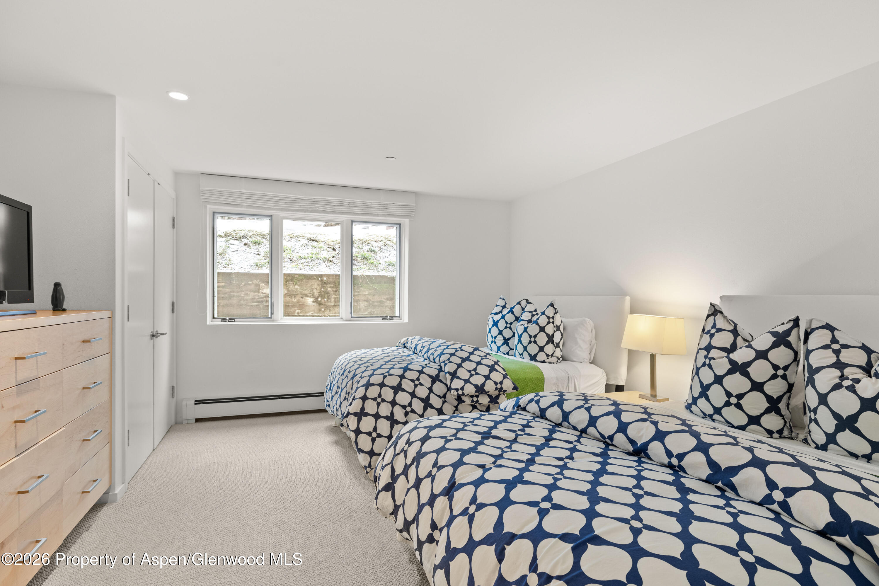 55 Overlook Drive Aspen, CO 81611 - Photo 19 of 25 a bedroom with a bed and a window