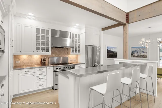 a kitchen with appliances cabinets and a counter top space