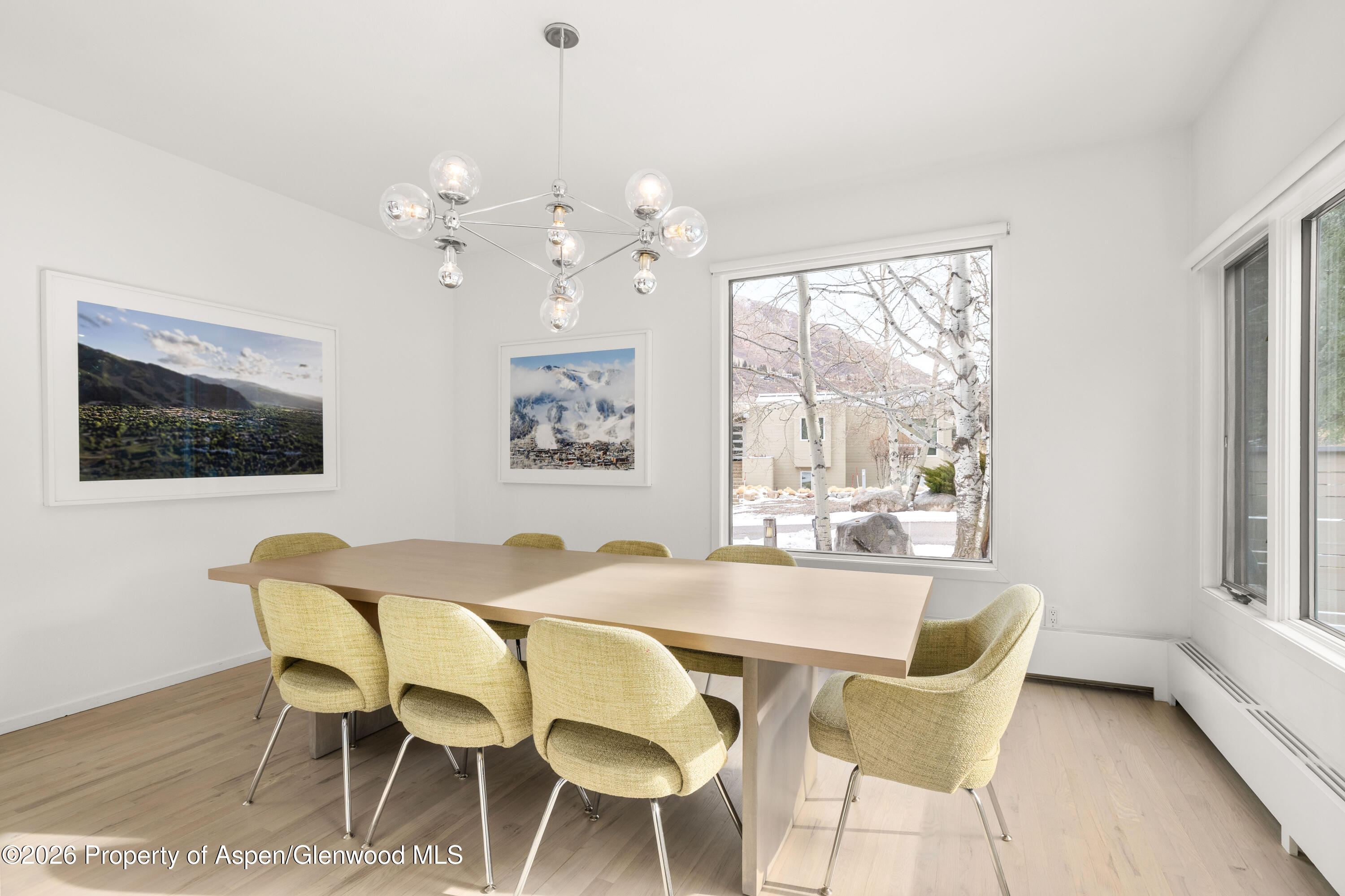 55 Overlook Drive Aspen, CO 81611 - Photo 3 of 25 a dining room with furniture a window and wooden floor