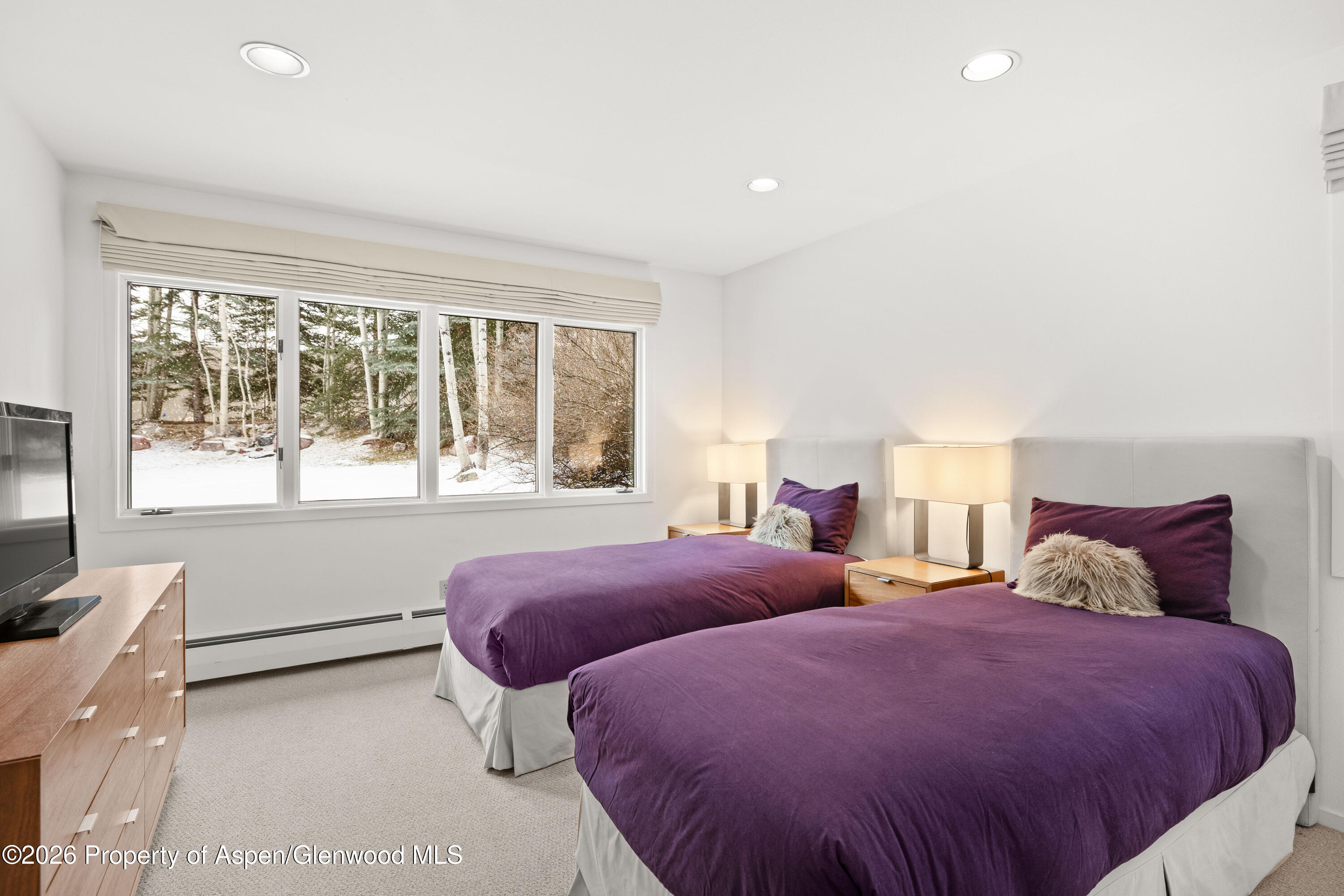 55 Overlook Drive Aspen, CO 81611 - Photo 9 of 25 a bedroom with two beds and a large window