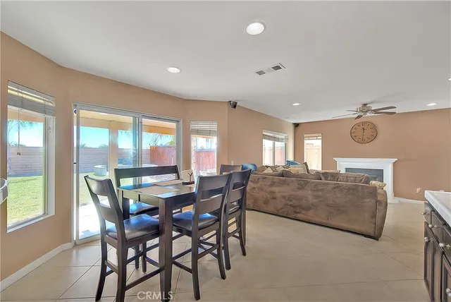 a view of dining room and livingroom with furniture wooden floor and a rug