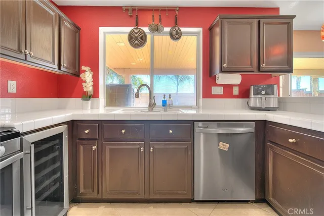 a kitchen with a refrigerator and cabinets