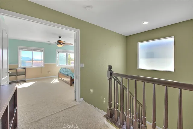 a bedroom with bed and window