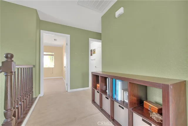 a bedroom with a bed and a dresser in it