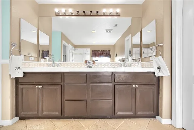 a bathroom with a sink a toilet and a shower curtain