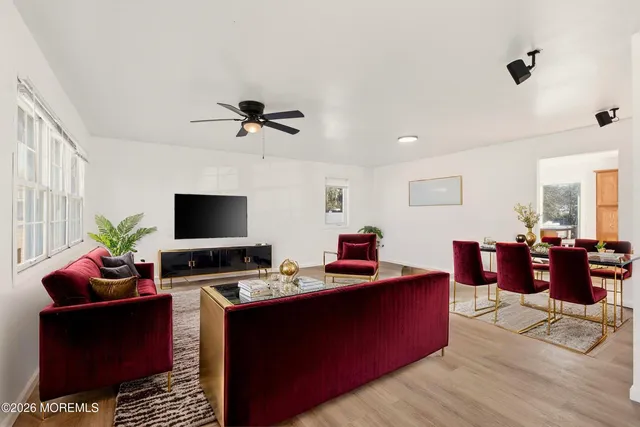 a work room with furniture and a flat screen tv