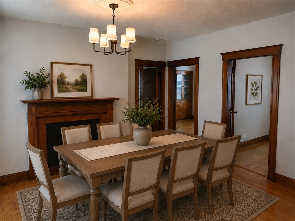 2 Hillside Street, Unit 3 Worcester, MA 01610 - Photo 8 of 30 a view of a dining room with furniture and chandelier