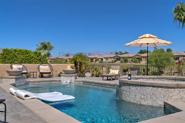a view of a swimming pool with a patio