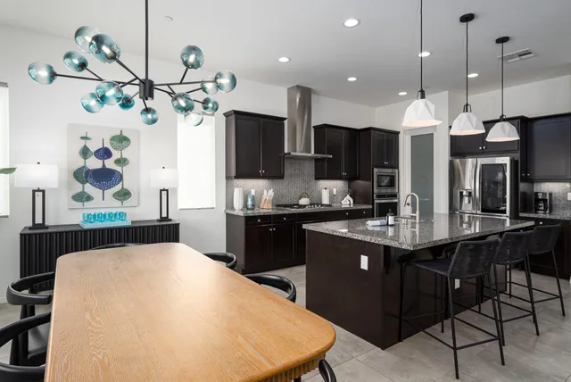 a bedroom with bed and a chair