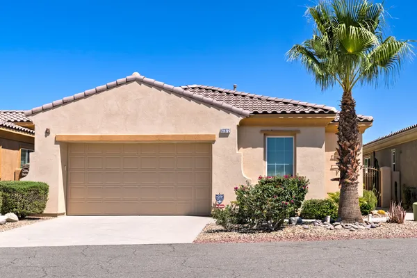a front view of a house with a garage
