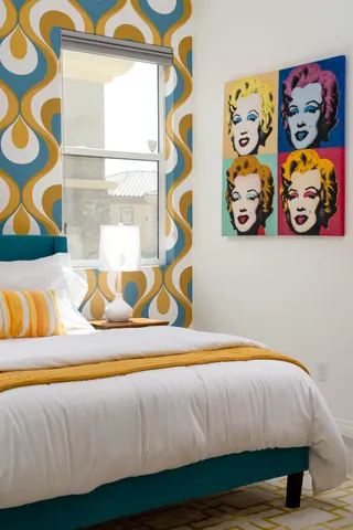 a bedroom with a bed and a table