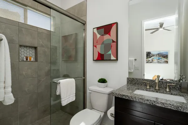 a bedroom with a bed and a view of bathroom