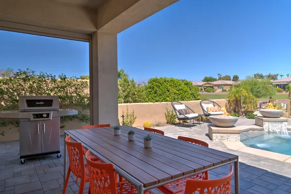 a view of a swimming pool with lounge chairs