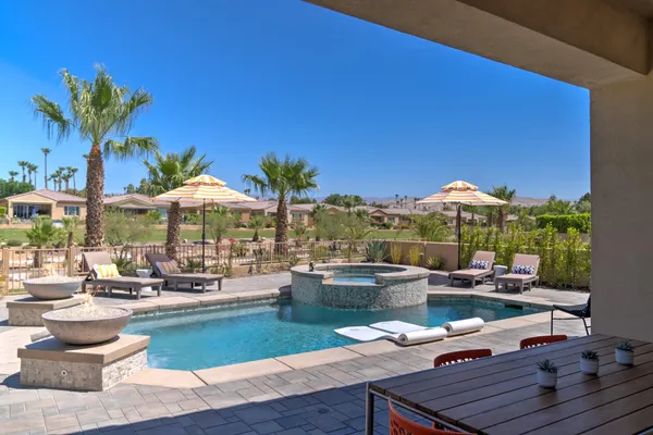 a view of a backyard with a patio