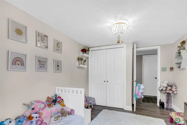 a bedroom with a bed and furniture