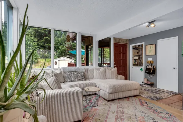 a living room with furniture and a large window