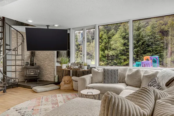 a living room with furniture and a flat screen tv