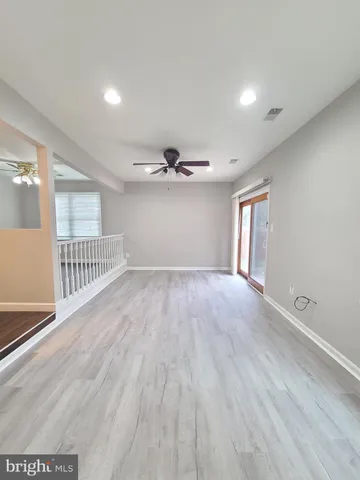 a spacious bathroom with a double vanity sink a mirror and a shower