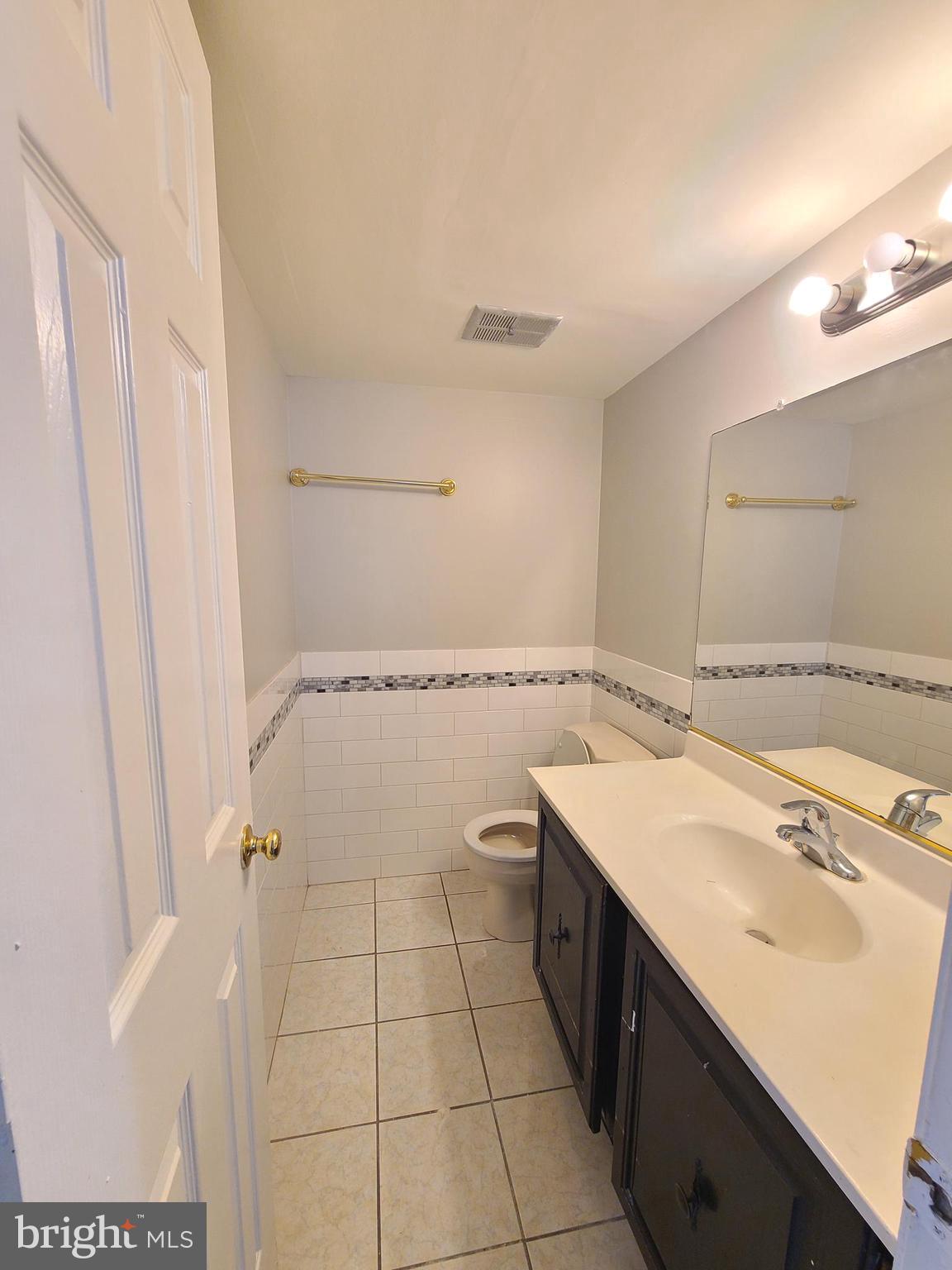 9050 Reynolds Place Manassas, VA 20110 - Photo 14 of 26 a spacious bathroom with a double vanity sink a mirror and a shower